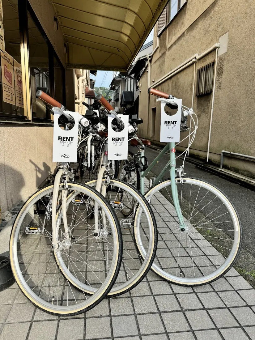 Three tokyobikes parked at the shop door